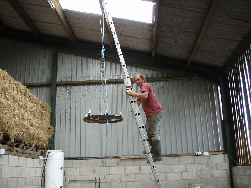 Steve putting chandelier over bar.jpg